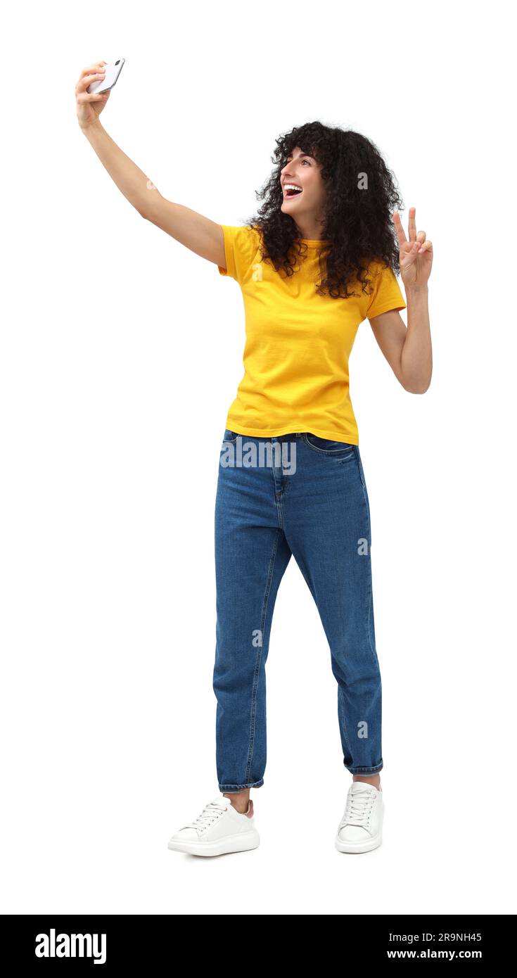Beautiful young woman taking selfie on white background Stock Photo - Alamy