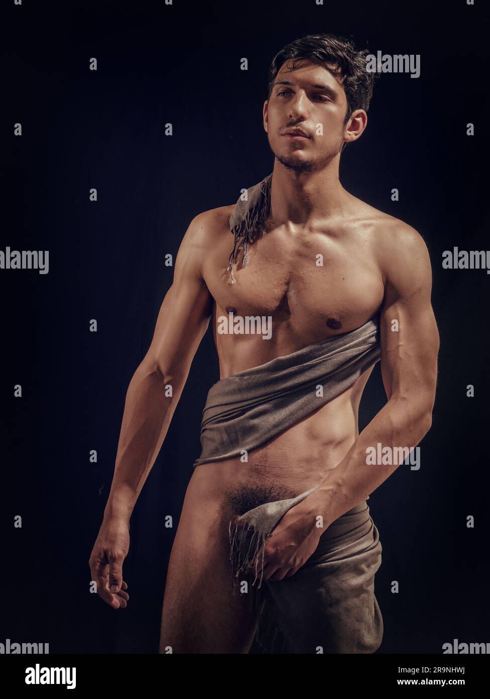 Totally naked athletic handsome young man in studio Stock Photo - Alamy