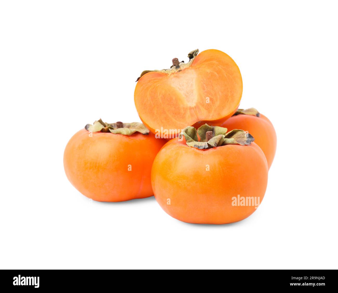 Whole and cut delicious ripe juicy persimmons on white background Stock ...
