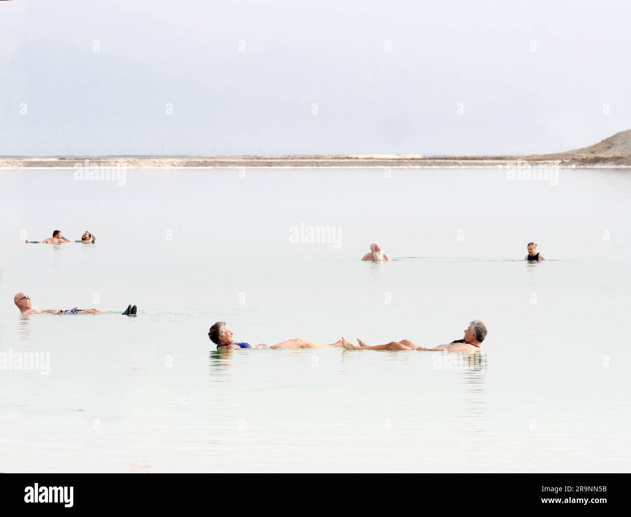 Sandwiched in a rift valley between Jordan to the east and and Israel to the west lies an unusual salt lake; this happens to be the lowest land-based Stock Photo