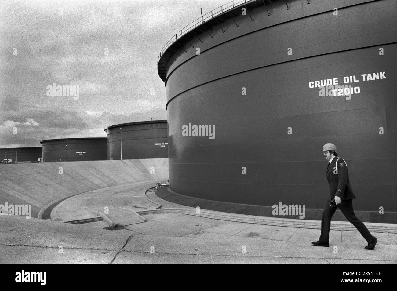 North Sea oil security guard at Sullom Voe Terminal. Oil storage tanks for British Petroleum (BP). Sullom Voe, Shetlands Mainland, Shetland Islands, Scotland, circa 1979. 1970s HOMER SYKES Stock Photo