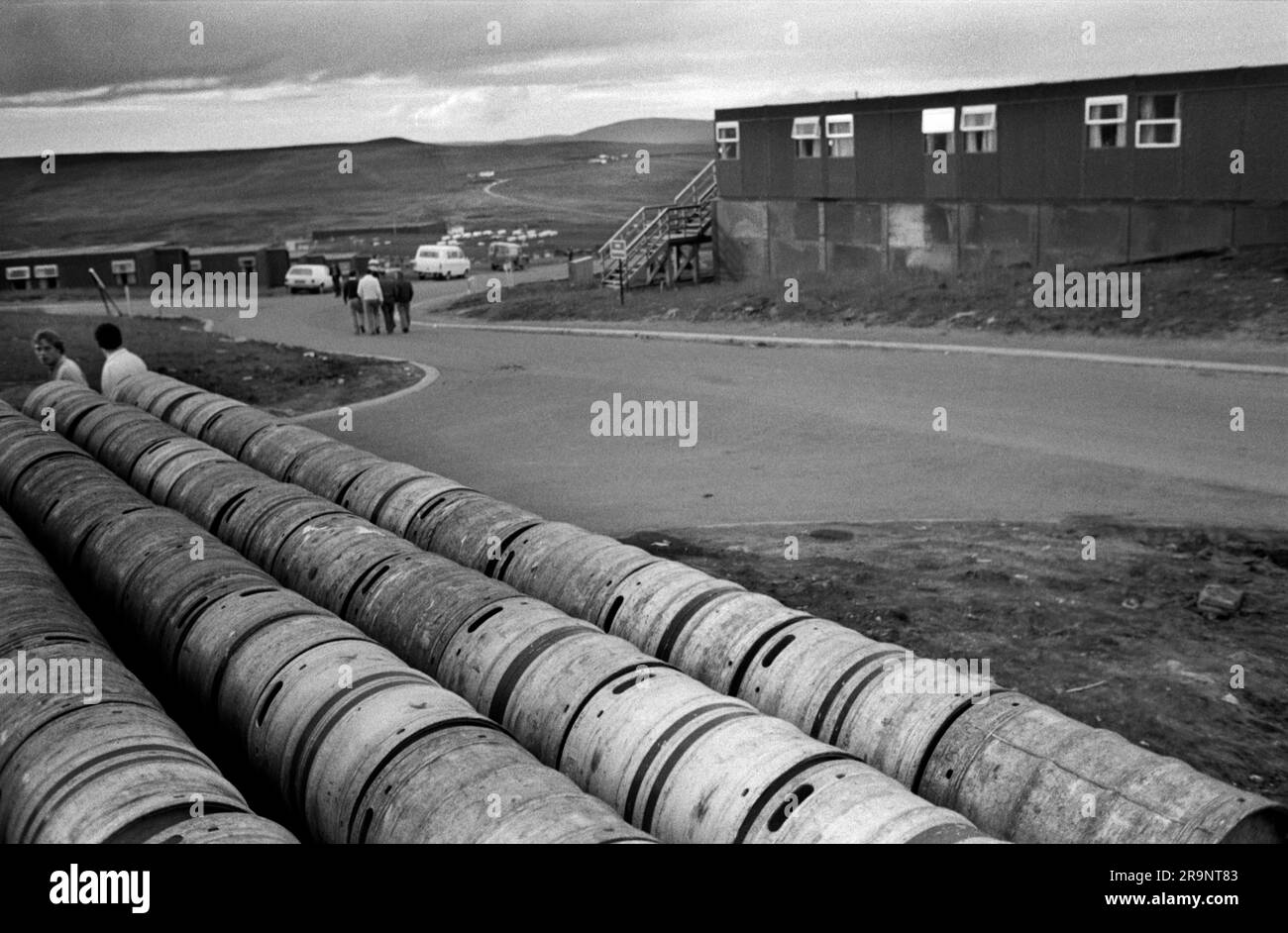 North Sea oil at Sullom Voe Terminal under construction. Beer barrels outside a bar at a construction workers housing site. Sullom Voe, Shetlands Mainland, Shetland Islands, Scotland circa 1979. 1970s HOMER SYKES Stock Photo
