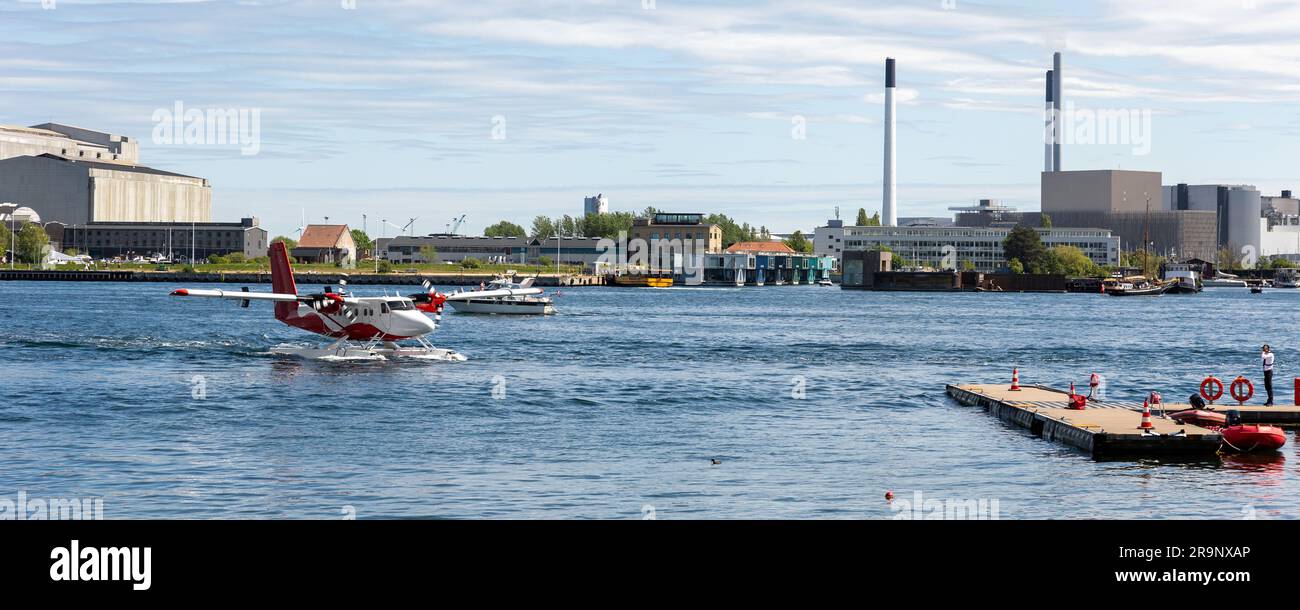 Small modern propeller business charter seaplane landing at Copenhagen ...
