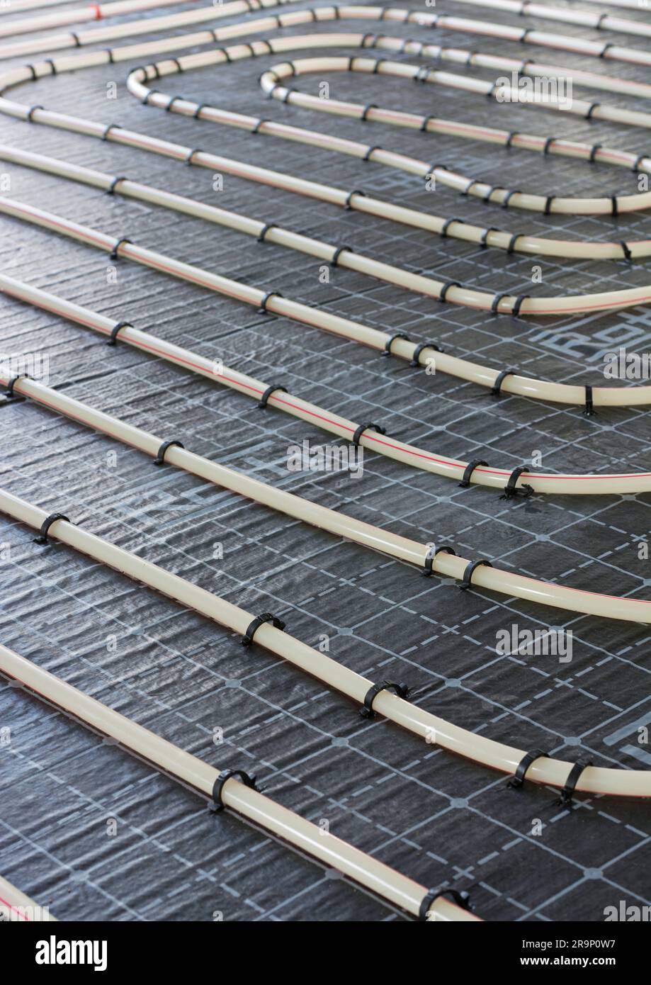 Detail of underfloor heating pipes, portrait format Stock Photo Alamy