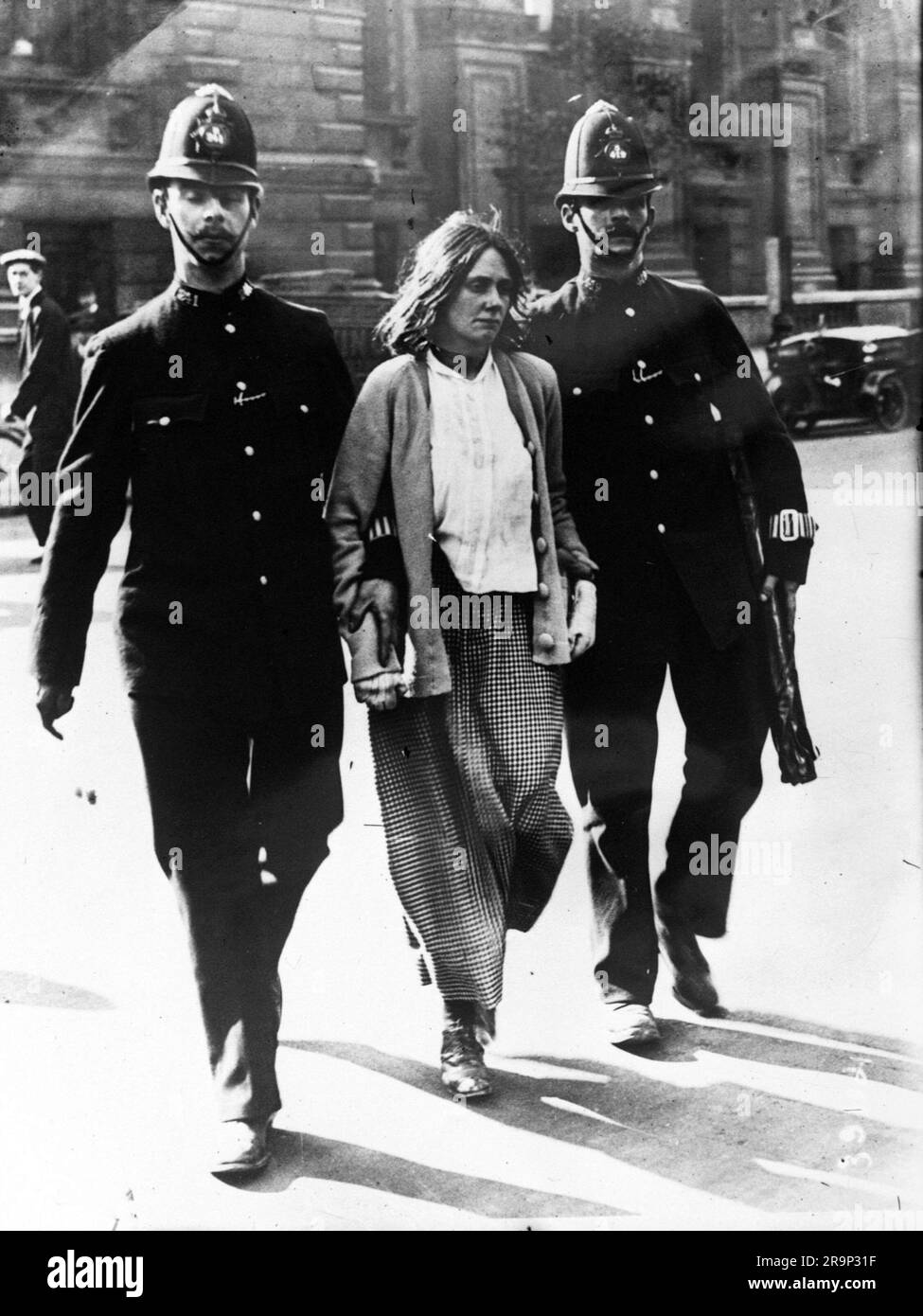 An unknown suffragette being arrested by police in London in 1914. Stock Photo