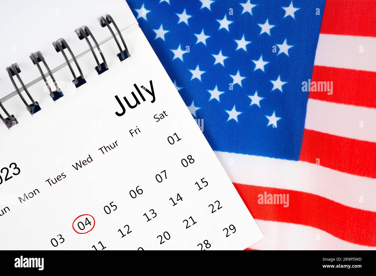 4 th July calendar with part of an American flag on white background