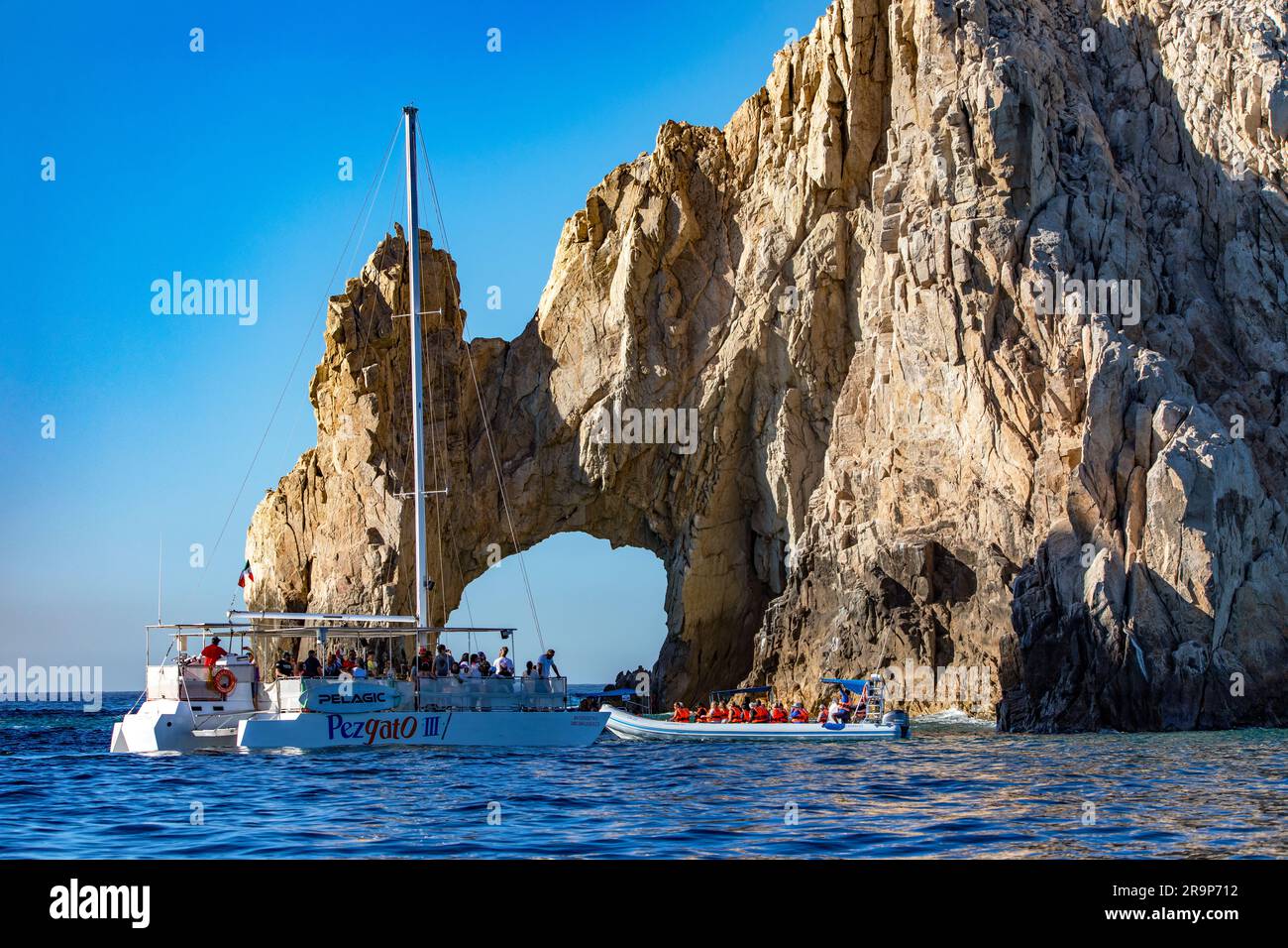 Cabo San Lucas Mexico January 10 2023 Catamaran And Zodiac Full Of cabo-san-lucas-mexico-january-10-2023-catamaran-and-zodiac-full-of