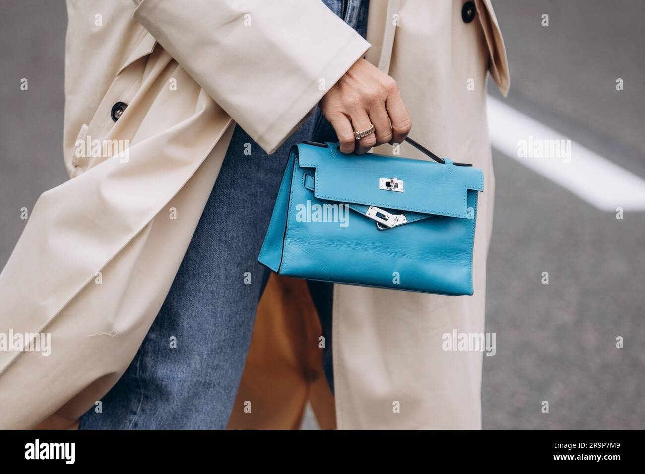 Paris, France - October, 3, 2021: Woman Wears Handbag Hermes Kelly