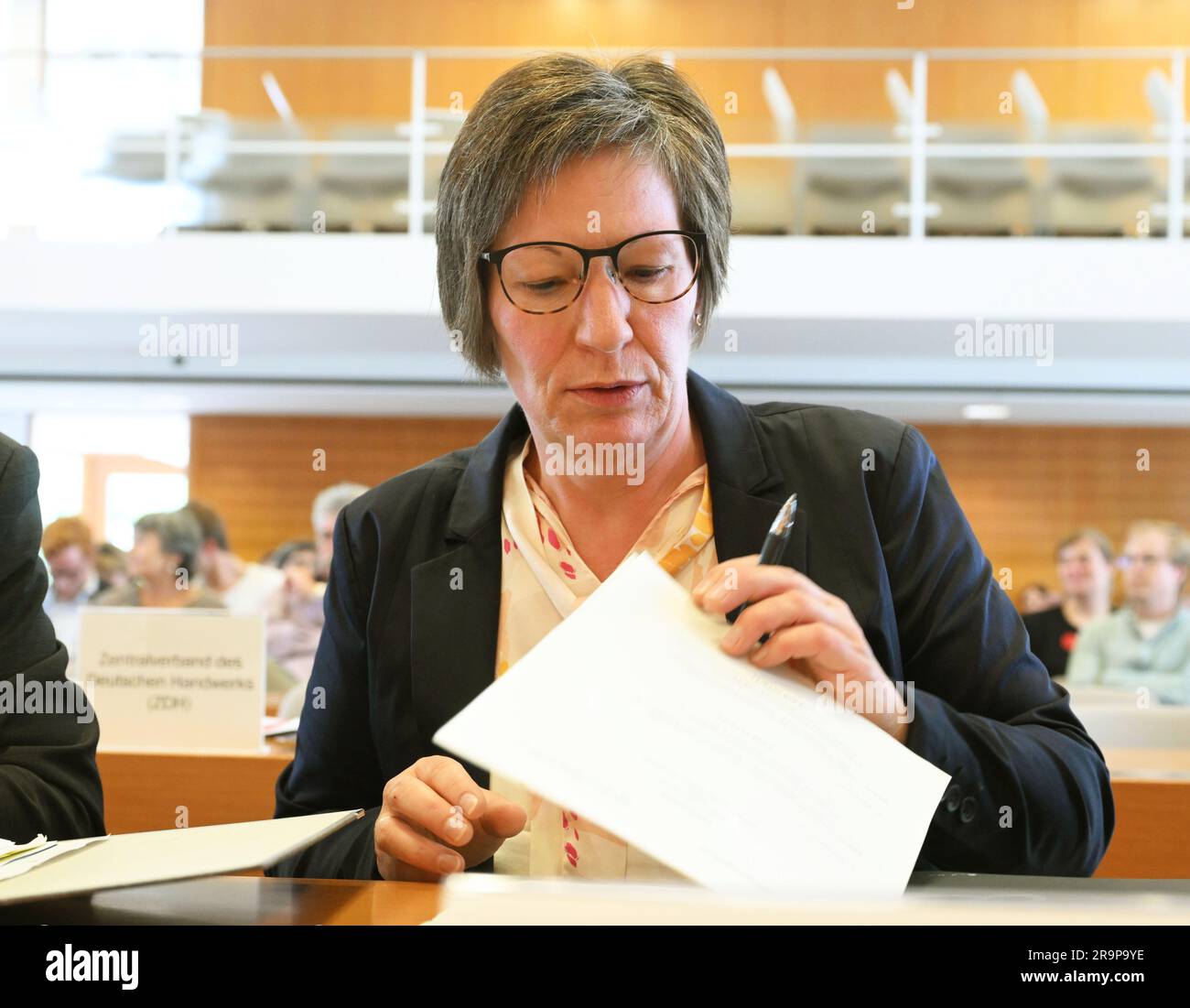 Karlsruhe, Germany. 28th June, 2023. Tanja Scherle, Federal Chairwoman of the Bundesverband Legasthenie und Dyskalkulie e.V. (BVL), is waiting at the Federal Constitutional Court for the start of the oral proceedings in the case of 'Zeugnisvermerke bei Legasthenikern'. The issue at stake is whether dyslexics must accept a report card note stating that their spelling performance was not included in their grades. Credit: Uli Deck/dpa/Alamy Live News Stock Photo