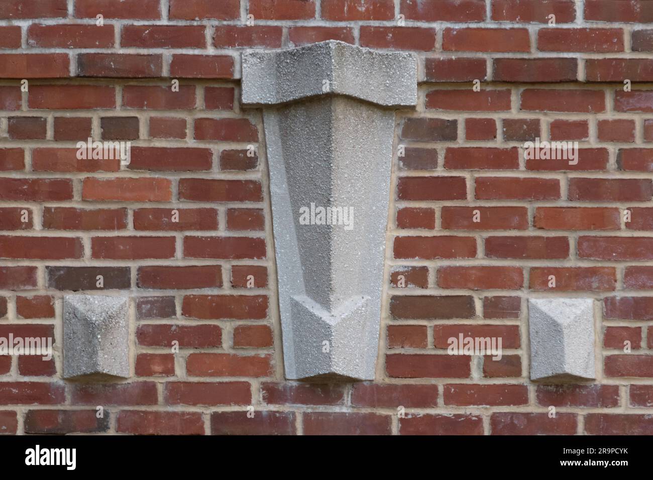 decorative molded concrete architectural detail appliqued on a red