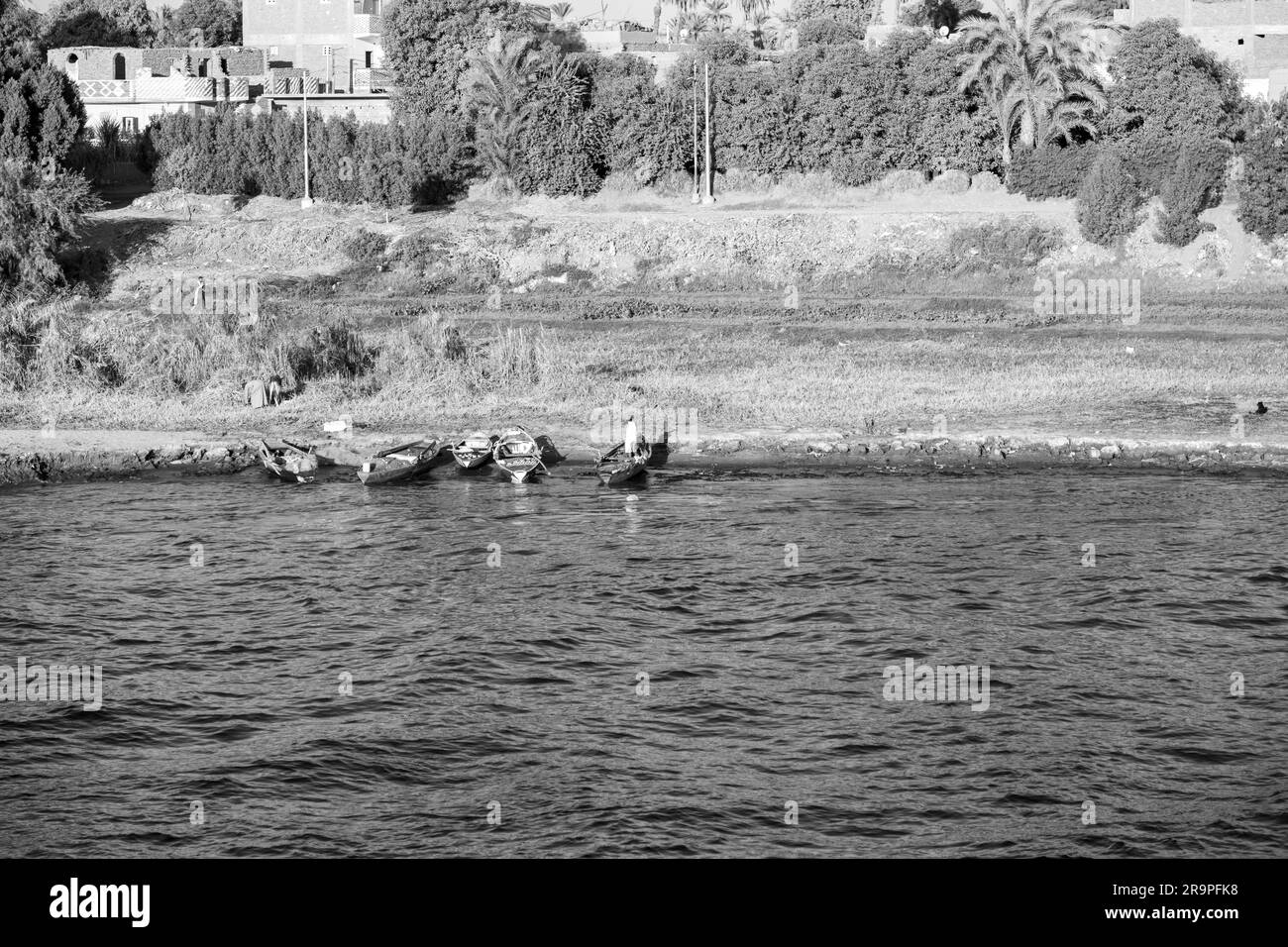 Egyptian Fisherman by the Nile River Bank in Black and White Stock