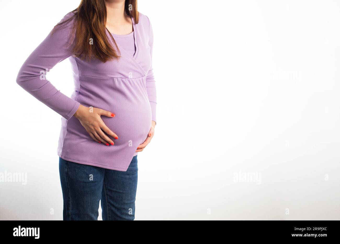 Pain and indigestion in a pregnant girl on a white background. The