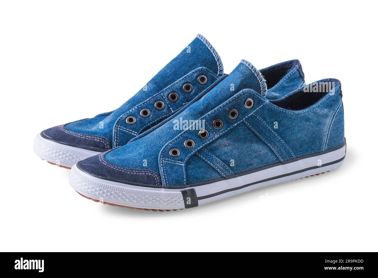 Blue denim sneakers with rubber sole without laces isolated on white Stock Photo