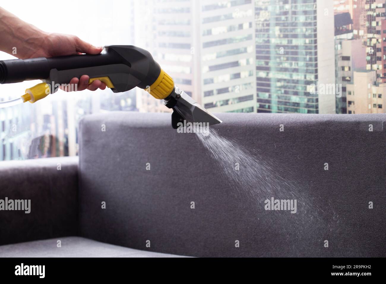 Applying a special cleaning solution to clean stains and dirt on