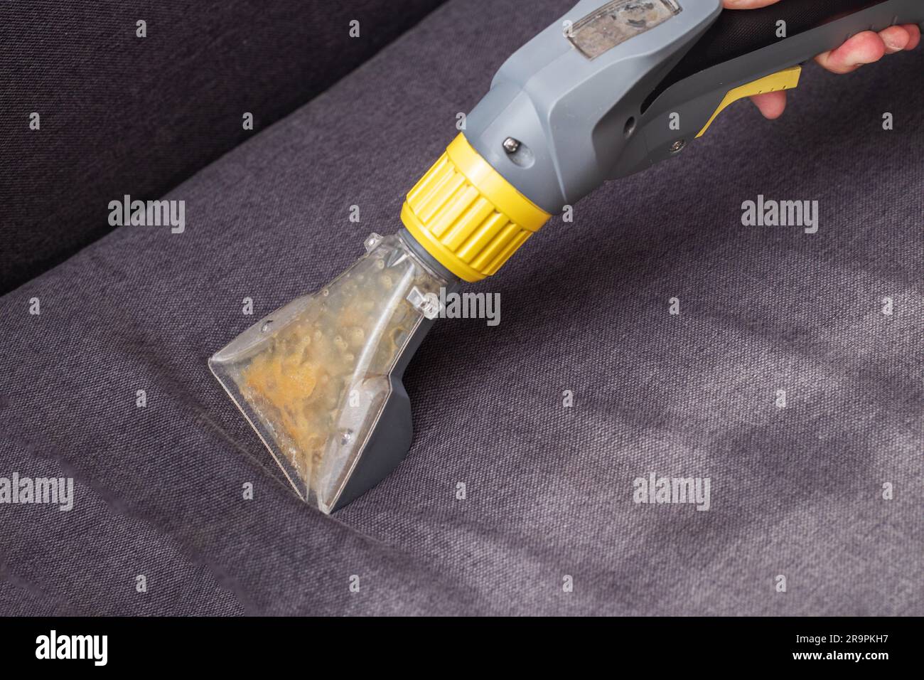 Professional dry cleaning of the sofa with a special chemical solution