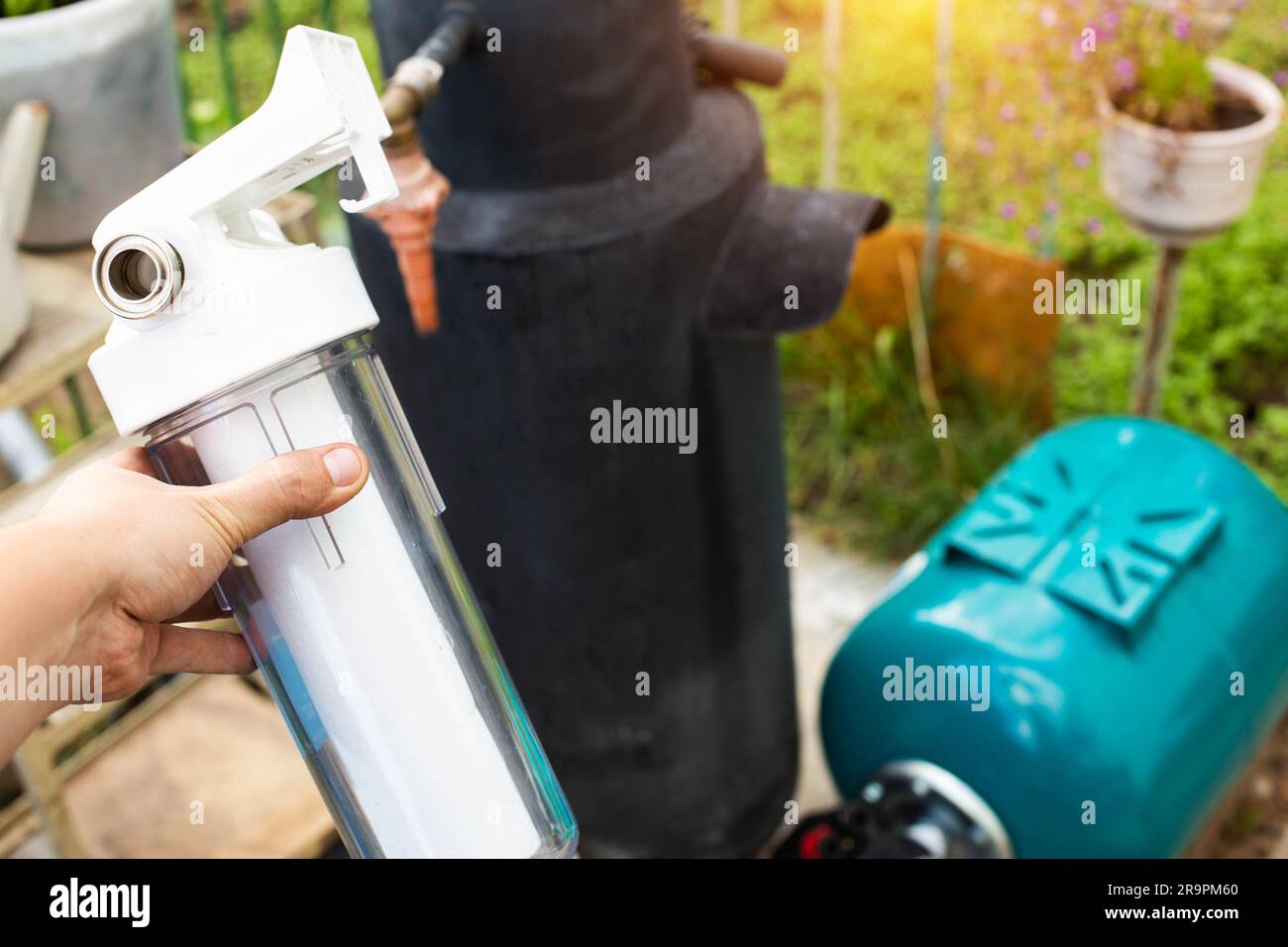 Filtration of water from a well with a sand and dirt filter. Water