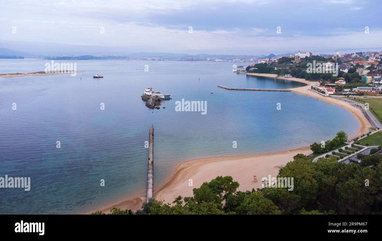 Aerial view of Santander Bay with clouds reflected in the water, island and beaches. Early morning. Santander, Cantabria, Spain. Stock Photo