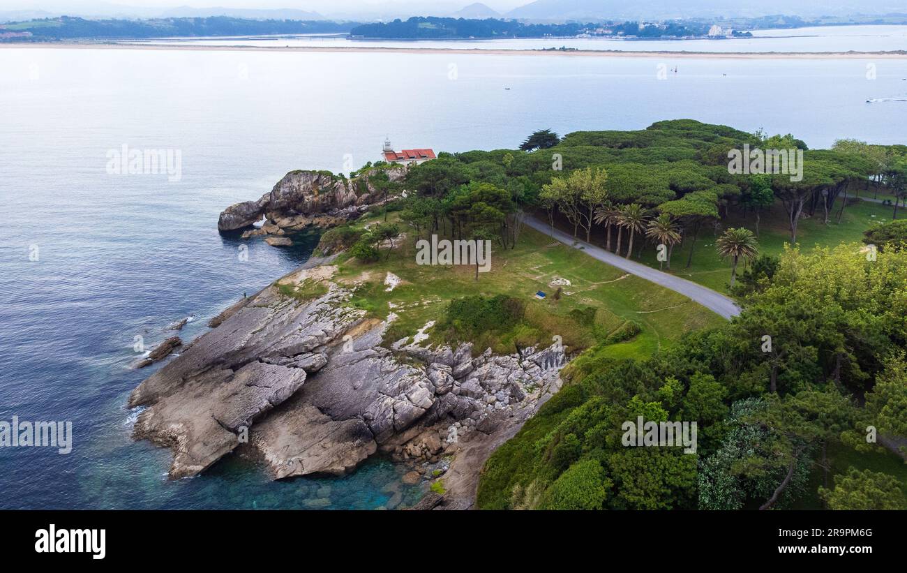 Cliffs, park, and lighthouse on the edge of Magdalena Peninsula surrounded by the Atlantic Ocean. Santander, Cantabria, Spain Stock Photo
