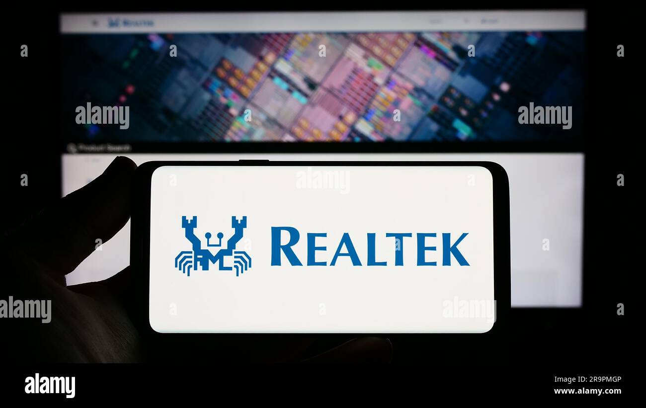 Person holding smartphone with logo of Taiwanese company Realtek