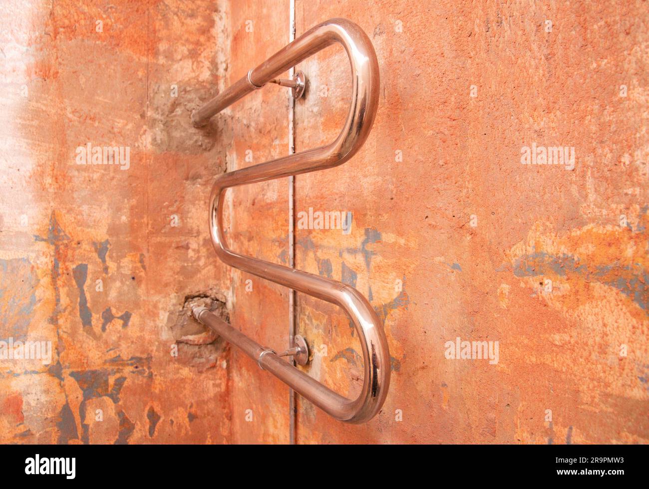 Replacing and relocating a heated towel rail with hot water in the