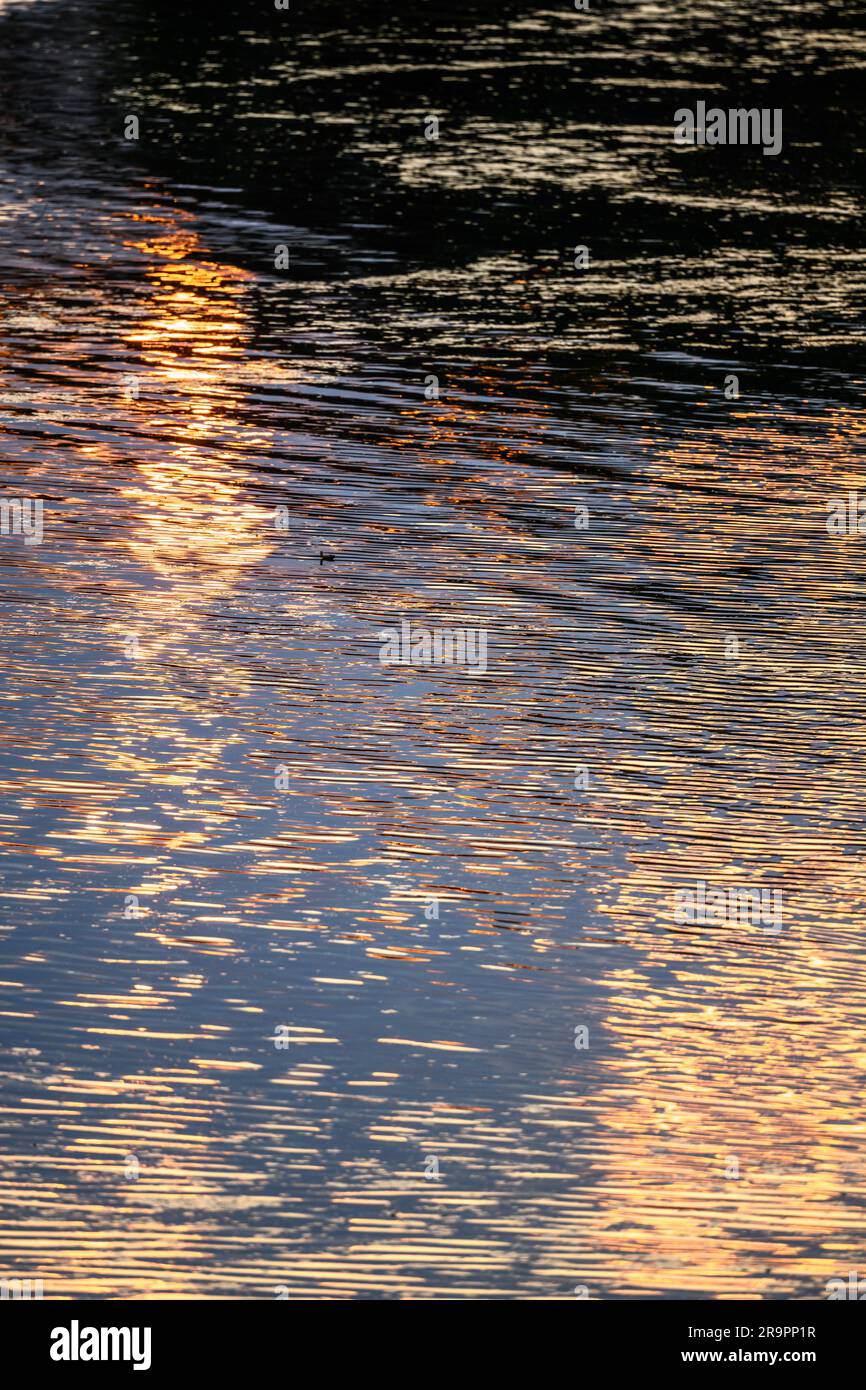 Sunset reflecting in water hi-res stock photography and images - Alamy