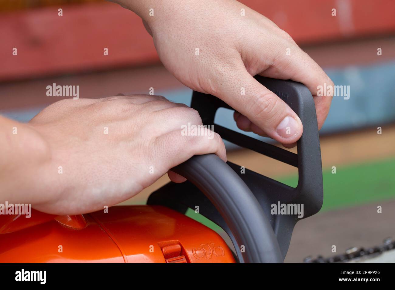 The process of activating the chain brake in a chainsaw before starting