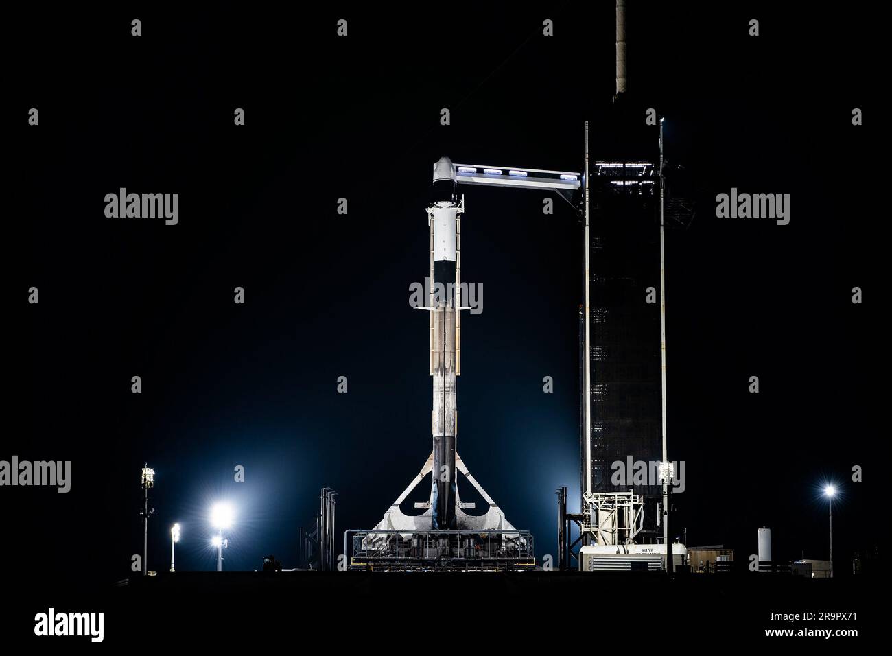 NASA/SpaceX CRS-27 Vertical at LC-39A. A SpaceX Falcon 9 rocket, with the company’s Dragon spacecraft atop, is raised to a vertical position at NASA Kennedy Space Center’s Launch Complex 39A on March 13, 2023, in preparation for the 27th commercial resupply services launch to the International Space Station. The mission will deliver new science investigations, supplies, and equipment to the crew aboard the space station, including the final two experiments comprising the National Institutes for Health and International Space Station National Laboratory’s Tissue Chips in Space initiative, Cardi Stock Photo