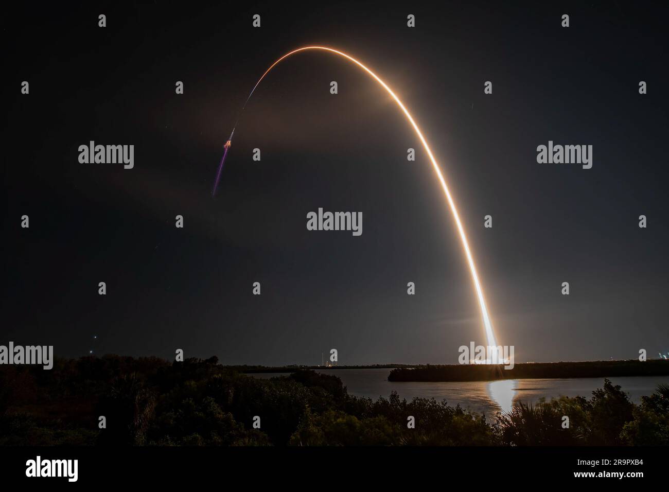 SpaceX CRS-27 Liftoff. Creating a golden streak in the night sky, a SpaceX Falcon 9 rocket soars upward after liftoff from Launch Complex 39A at NASA’s Kennedy Space Center in Florida on March 14, 2023, on the company’s 27th Commercial Resupply Services mission for the agency to the International Space Station. Liftoff was at 8:30 p.m. EDT. The Dragon spacecraft will deliver more than 6,000 pounds of science and research, supplies, and equipment to the crew aboard the space station, including the final two experiments comprising the National Institutes for Health and International Space Statio Stock Photo