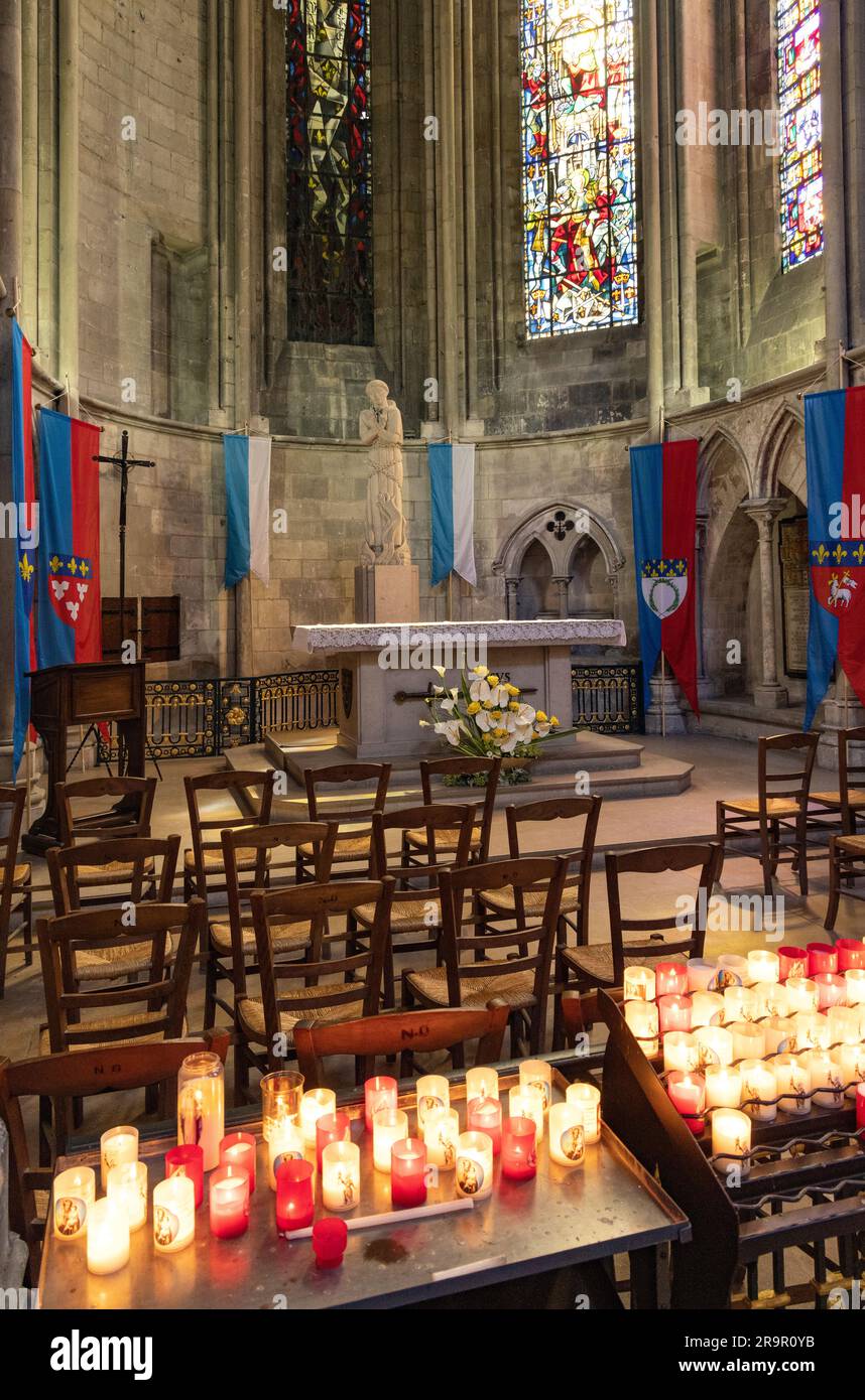The Chapel of St Joan of Arc, decorated with flags, pennants and candles, Rouen Cathedral of Notre Dame interior, Rouen Normandy France Stock Photo