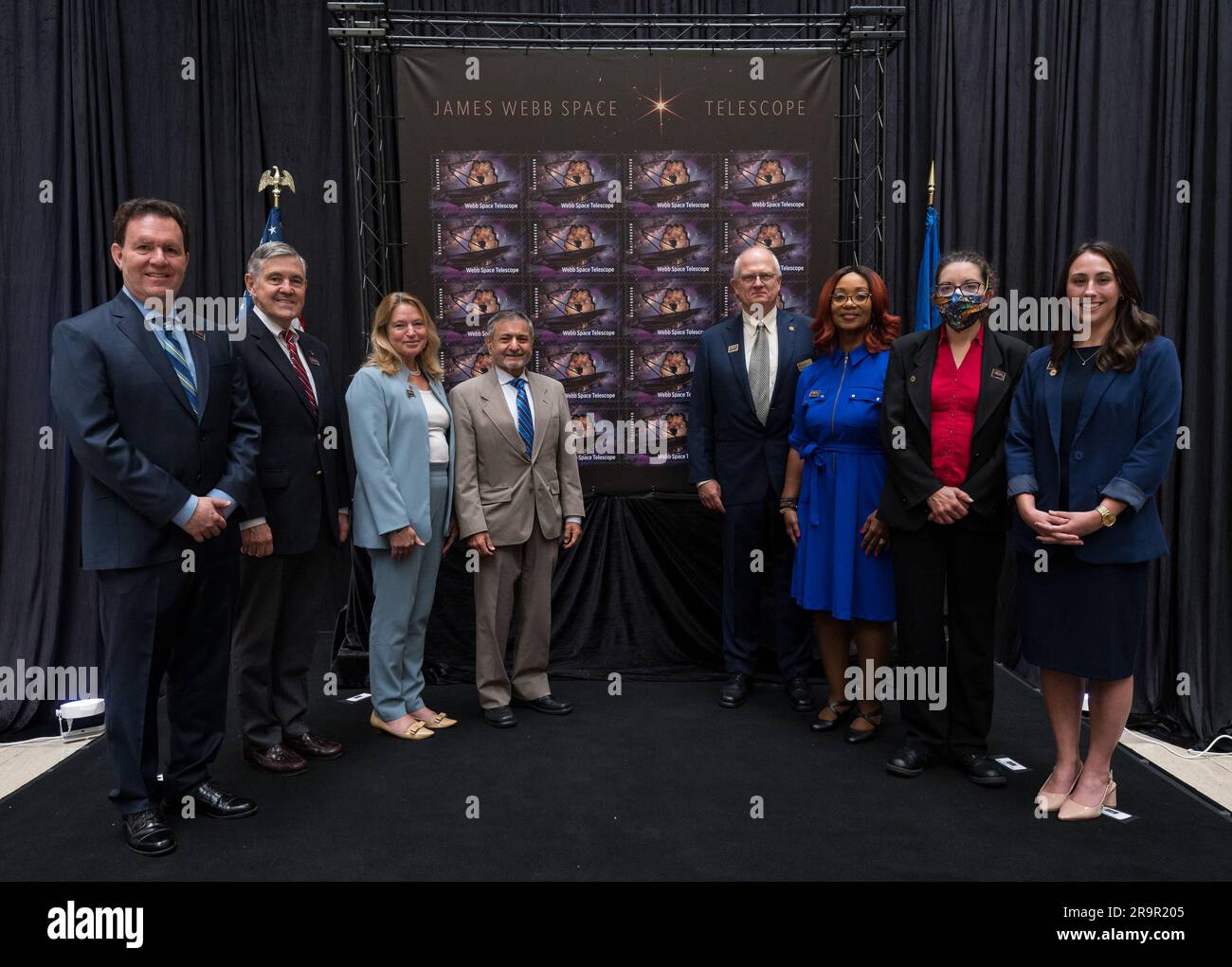 JWST Stamp Issuance Ceremony. From left to right, NASA’s Goddard Space Flight Center Webb Optical Telescope Element Manager, Lee Feinberg, NASA Associate Administrator and former astronaut Bob Cabana, Smithsonian Institution Under Secretary for Service and Research, Ellen Stofan, United States Postal Service Vice Chairman, Board of Governors, Anton Hajjar, National Postal Museum Deputy Director Toby Mensforth, Lisa Whitehead, USPS, NASA’s Goddard Space Flight Center Webb Deputy Observatory Project Scientist, Erin Smith, and NASA public affairs specialist, Alice Fisher, pose for a photo at the Stock Photo