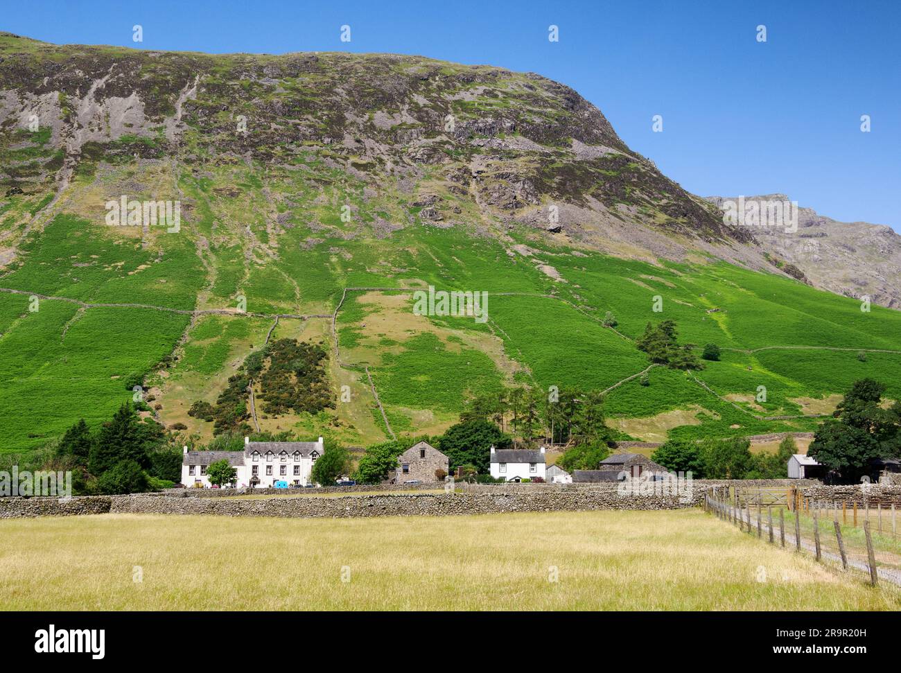 The hamlet of Wasdale Head nestled below Yewbarrow in the English Lake District Cumbria UK Stock Photo