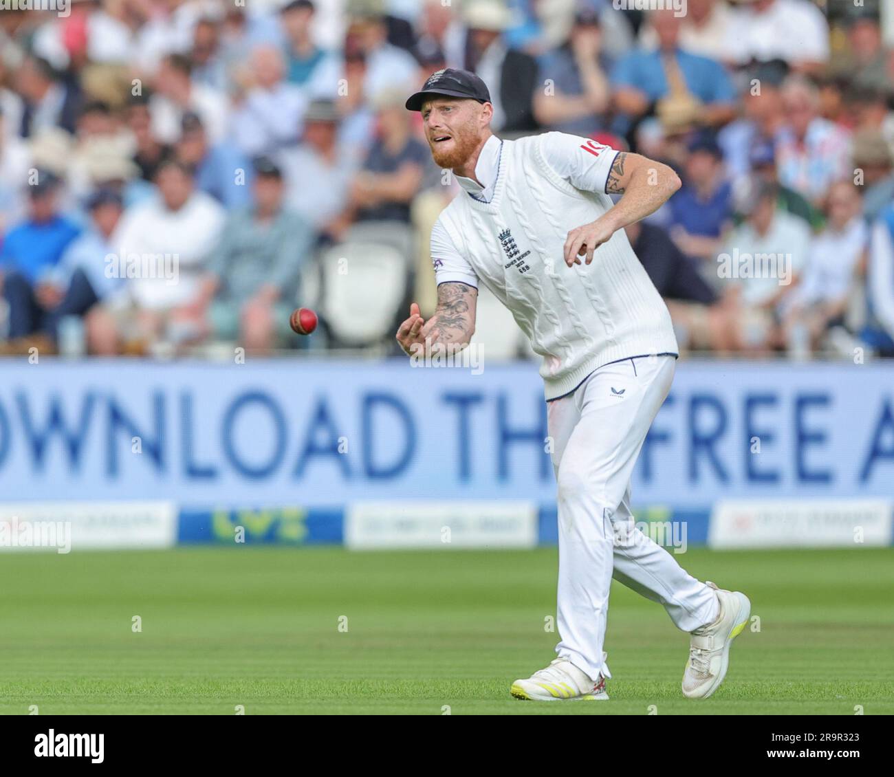 London, UK. 28th June, 2023. Ben Stokes of England throws the ball back to the wicket during the