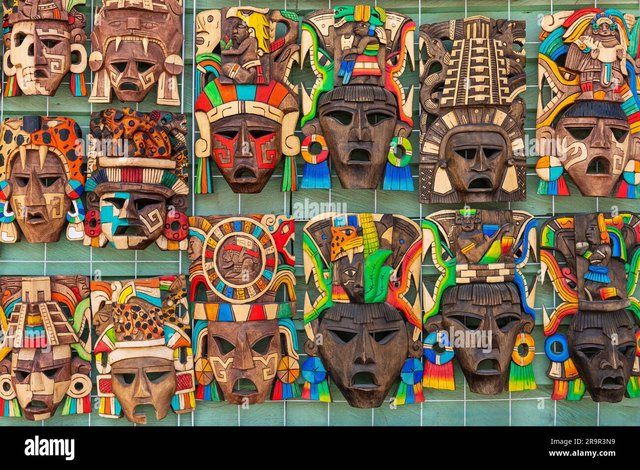 Mexican wooden mask souvenir handicraft on local market, Mexico. Stock Photo