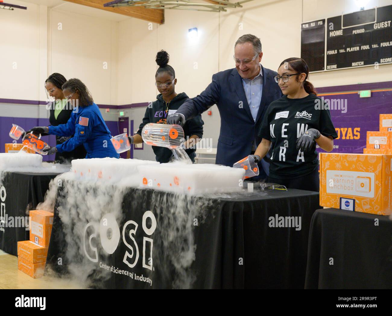 Second Gentleman Douglas Emhoff Joins NASA to Distribute STEM Artemis Learning Lunchboxes to Oakland Youth. Second Gentleman Douglas Emhoff, second from right, participates in a “make a cloud” demonstration with students at the East Oakland Youth Development Center in Oakland, California. Hosted in honor of Women’s History Month by the Center of Science and Industry (COSI) under a NASA OSTEM agreement, the Oakland activities reached 500 East Bay students and provided five space-focused learning activities that showcase the diversity of STEM at NASA. Stock Photo