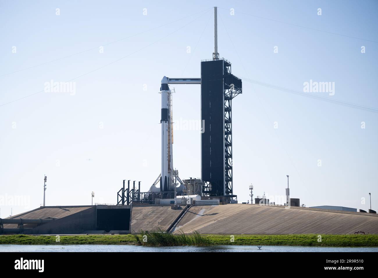 NASA’s SpaceX Crew-6 Preflight. ]A SpaceX Falcon 9 rocket with the ...