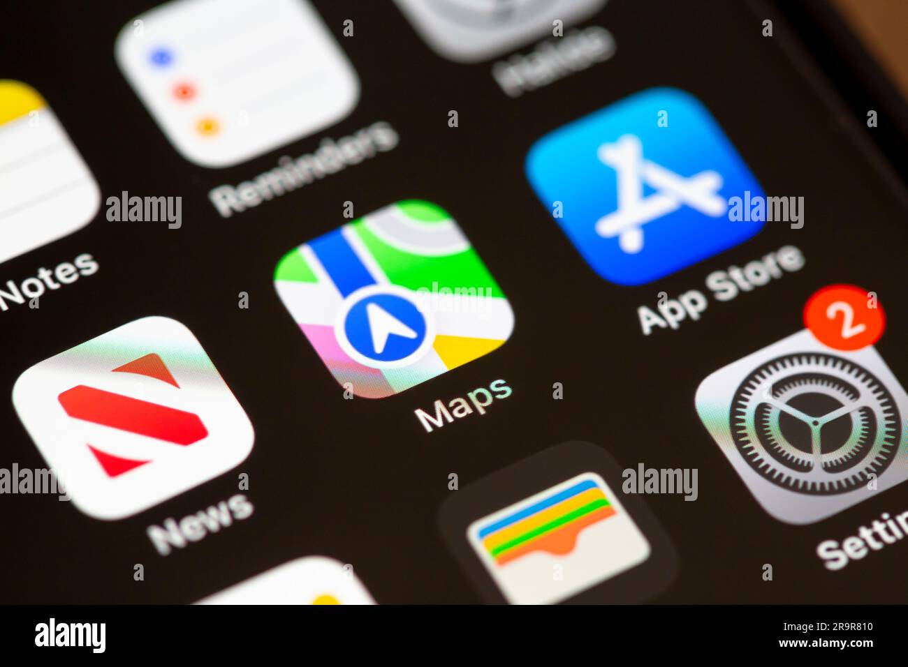 A close up of the Maps app icon on an Apple smartphone screen. Stock Photo