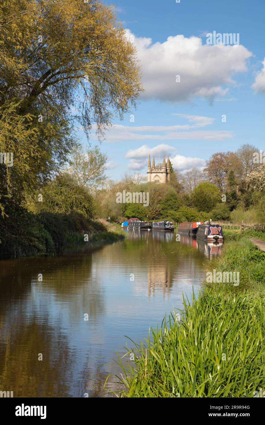 St Lawrence's church beside the Kennet and Avon Canal with narrowboats moored alongside, Hungerford, Berkshire, England, United Kingdom, Europe Stock Photo
