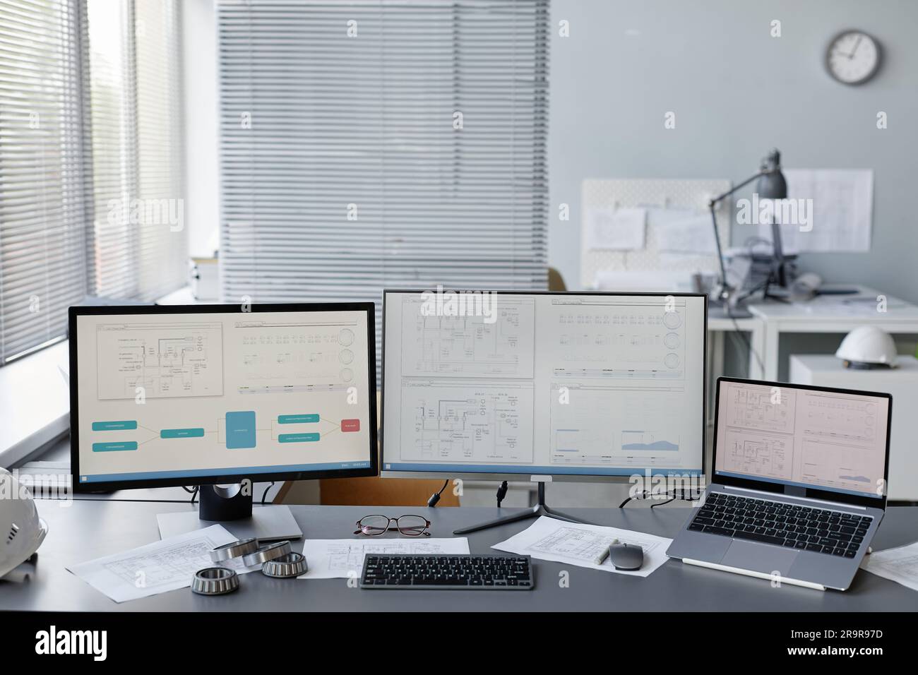 Background image of engineers workplace in office with plans and ...