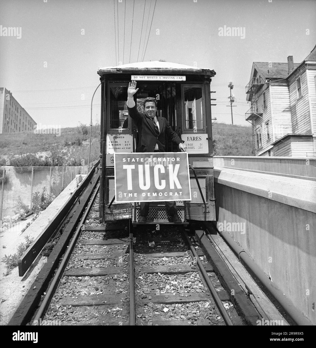 Richard Tuck, a political jester considered funny by most everybody except  Richard M. Nixon and Barry Goldwater, gags it up as he rides Angels Flight  Railroad in Los Angeles, April 13, 1966.