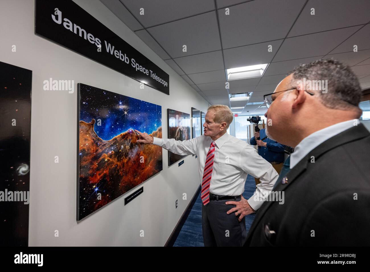 Department of Education MOU Signing Ceremony. NASA Administrator Bill Nelson, left, shows Secretary of Education Miguel Cardona, right, images taken by the James Webb Space Telescope prior to a memorandum of understanding (MOU) signing ceremony, Wednesday, May 24, 2023, at the Mary W. Jackson NASA Headquarters building in Washington. The NASA and Department of Education MOU is focused on strengthening the collaboration between the two agencies, including efforts that advance STEM education across the nation. Stock Photo