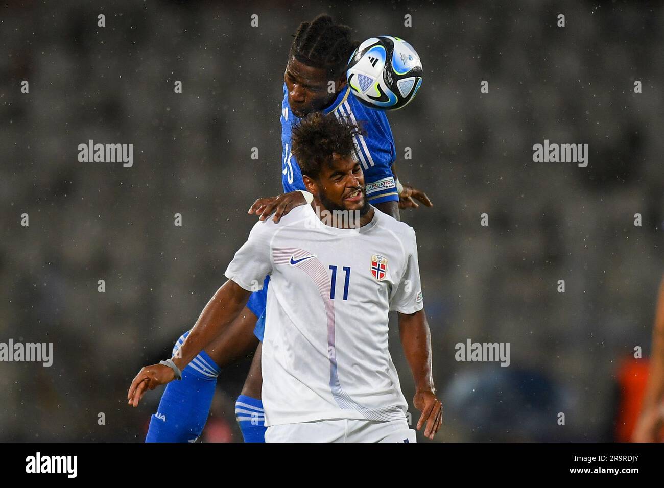 Norway's Emil Ceide, left, jumps for a header with Italy's Caleb Okoli ...