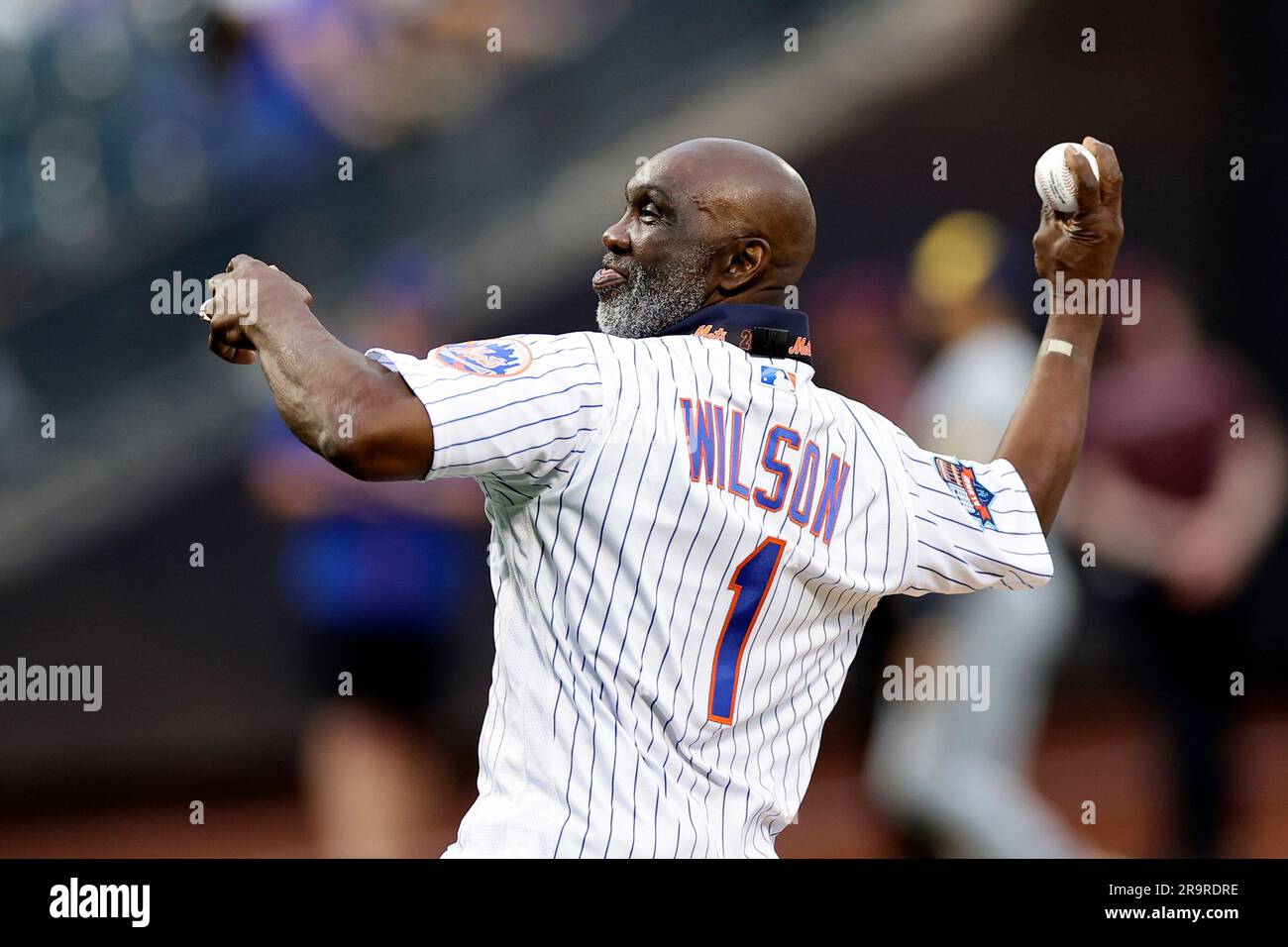 Former New York Mets' Mookie Wilson throws out a ceremonial first pitch  before a baseball game against the Milwaukee Brewers on Monday, June 26,  2023, in New York. (AP Photo/Adam Hunger Stock