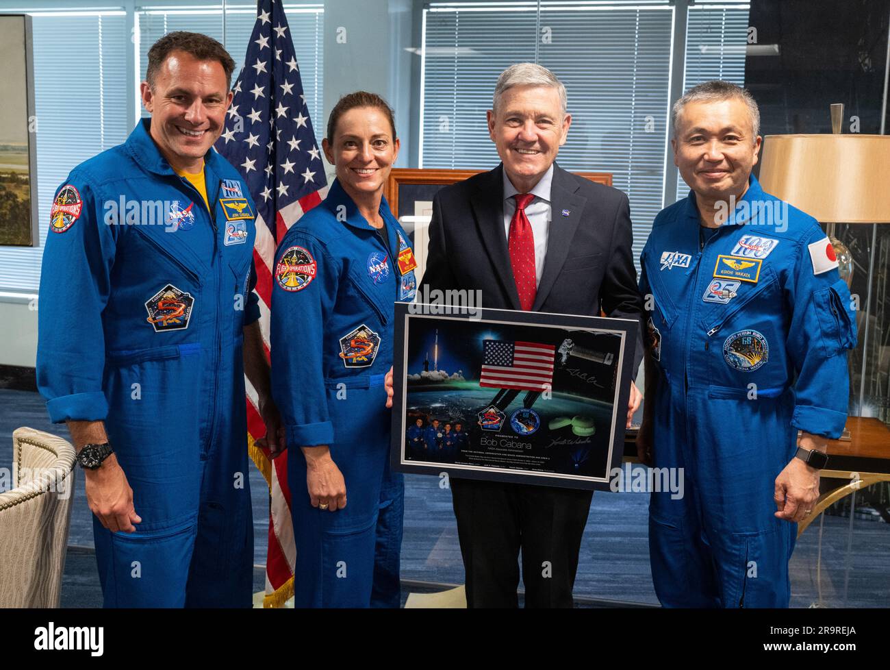 NASA’s SpaceX Crew-5 Astronauts with Agency Leadership. NASA’s SpaceX Crew-5 astronauts Josh Cassada, left, and Nicole Mann of NASA, second from left, of NASA and Japan Aerospace Exploration Agency (JAXA) astronaut Koichi Wakata, right, pose for a picture with NASA Associate Administrator Bob Cabana, second from right, after being presented with a montage from their flight, Monday, June 5, 2023 at the Mary W. Jackson NASA Headquarters building in Washington. Mann, Cassada, and Wakata spent 157 days in space as part of Expedition 68 aboard the International Space Station. Stock Photo