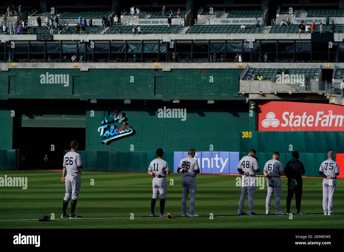 New York Yankees players listen to the national anthem before a baseball game against the Oakland Athletics in Oakland, Calif., Wednesday, June 28, 2023