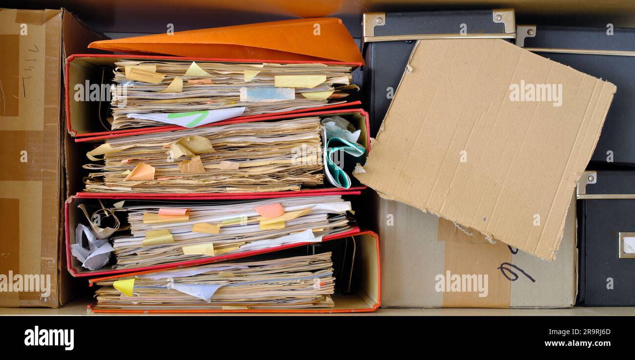 messy file folders,red tape, bureaucracy,aministration,business concept.Close up,free copy space. Stock Photo