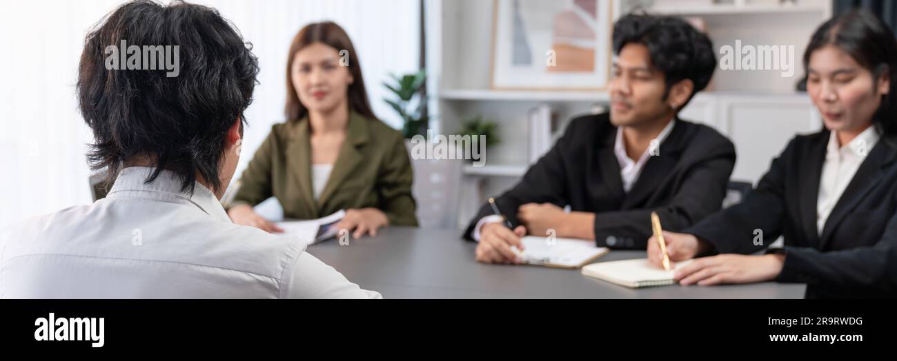 Candidate and interviewers discuss work experience and qualifications