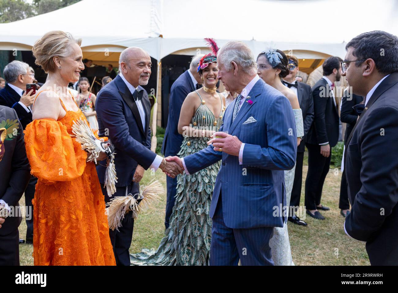 Britain's King Charles III greets Kristin Scott Thomas, left, and Christian  Louboutin, as he attends the Animal Ball at Lancaster House, in London,  Wednesday, June 28, 2023, to mark the 20th anniversary