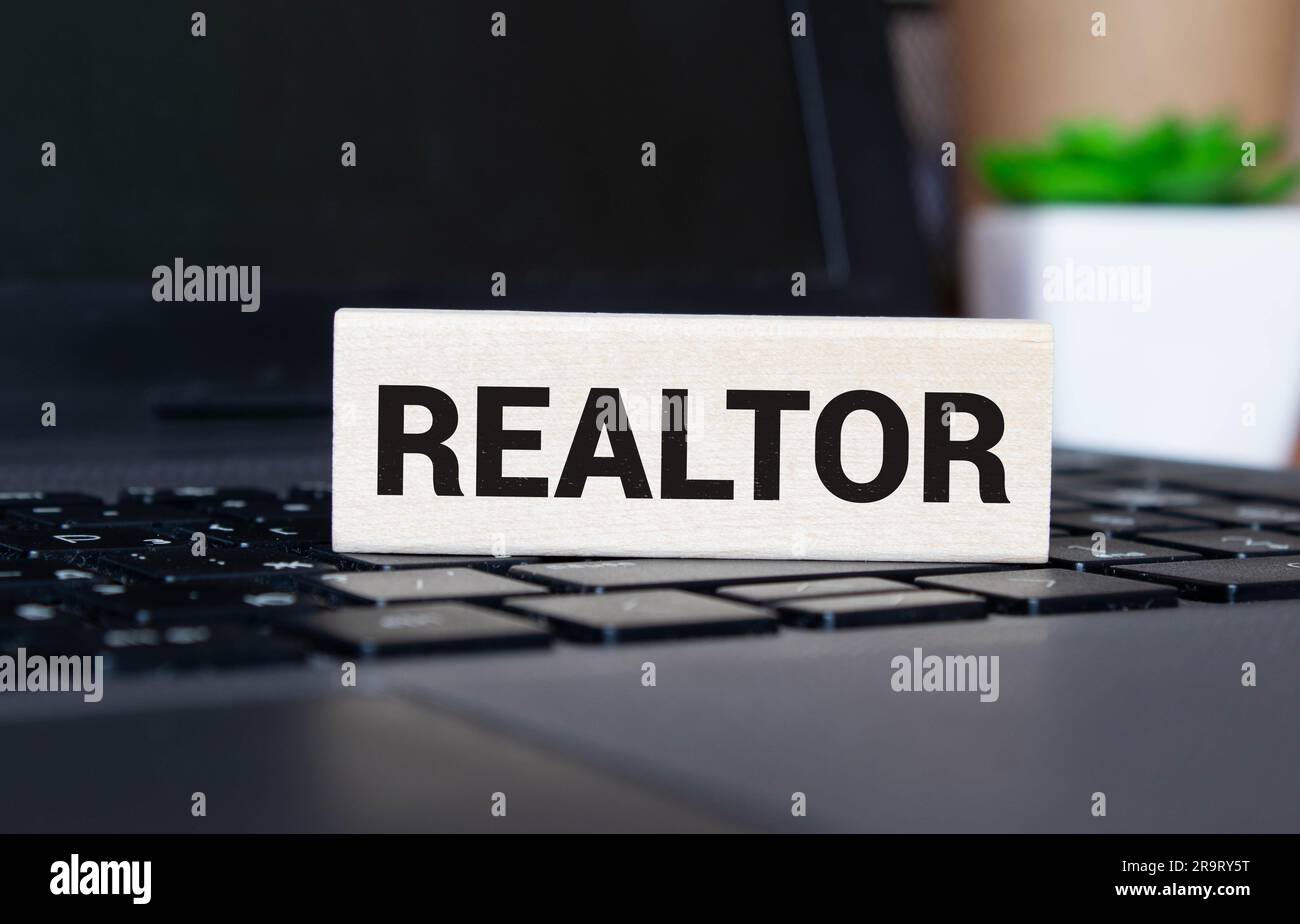 REALTOR inscription on the cover of the blue book Stock Photo - Alamy