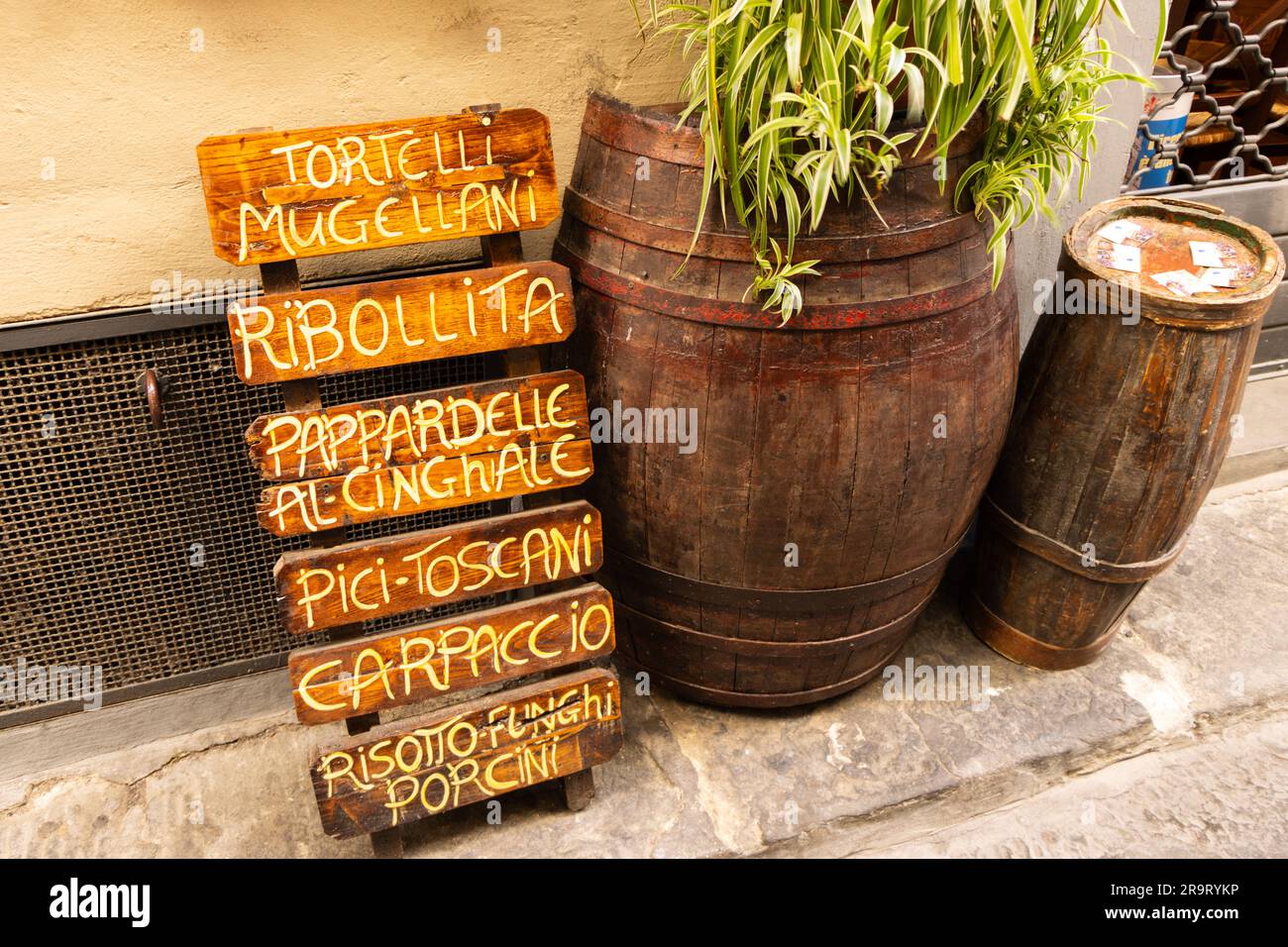 Wooden sign with a typical tuscan menu in a street of touristic city of