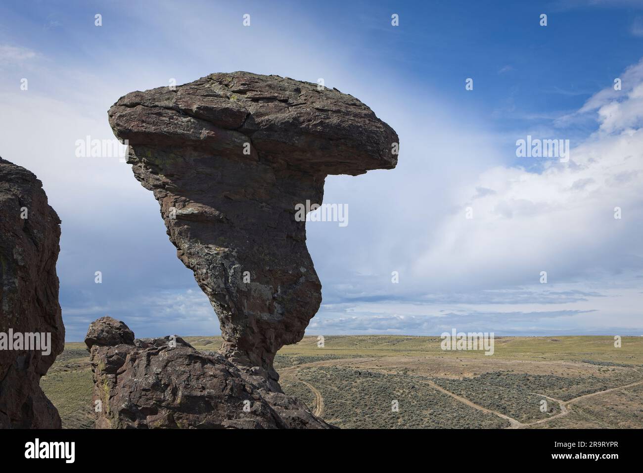 A photo of the famous landmark Balanced ROck against a partly cloudy